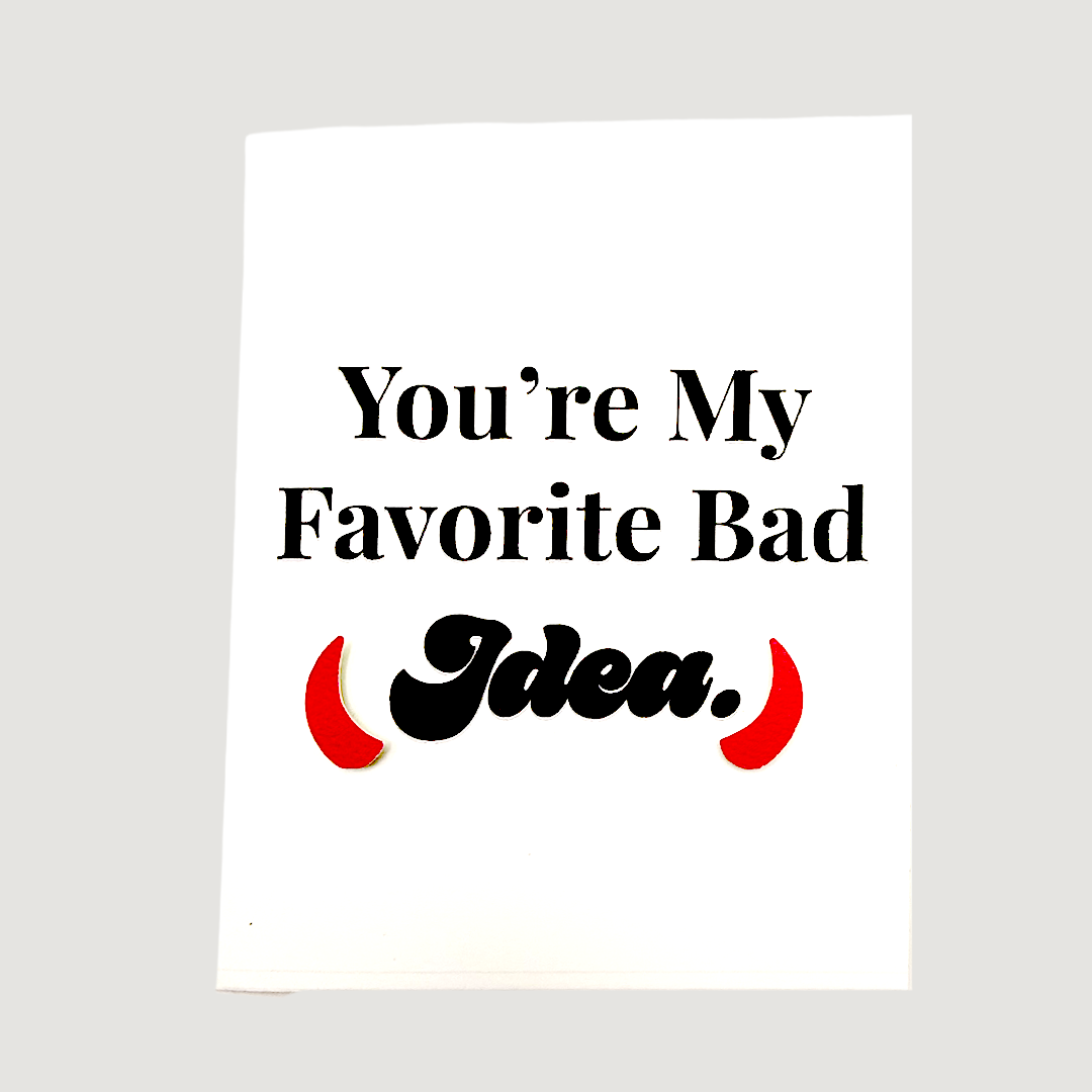 Front of card reading You're My Favorite Bad Idea with red devil horns accent